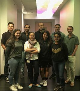 Members of the S. Thomas Carmichael laboratory gathered in a hallway.